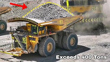 The Largest Trucks Carrying Loads Exceeding 400 Tonnes Small Excavators Load Trucks and Bulldozer