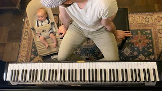 Baby is unimpressed with dad’s piano 😂