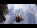 Teenager doing a gainer into pool over the camera