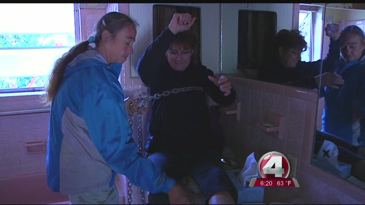 women chained to home to protest reverse mortgages