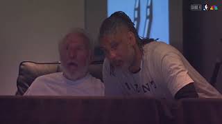 Tim Duncan talks to Gregg Popovich, and Victor Wembanyama talks with coach Mitch Johnson