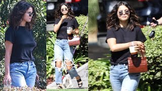 Selena gomez keeps it casual in ripped jeans and a black top as she
spends the afternoon la