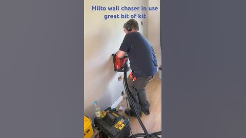 Hilti wall chaser in action, vacuum is in use to minimise dust