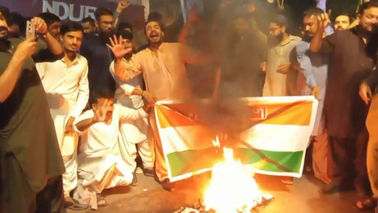 Pakistani protesters burn Indian flag after missile strikes | AFP