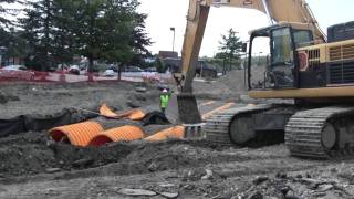 Cat 345CL Laying Out Rocks