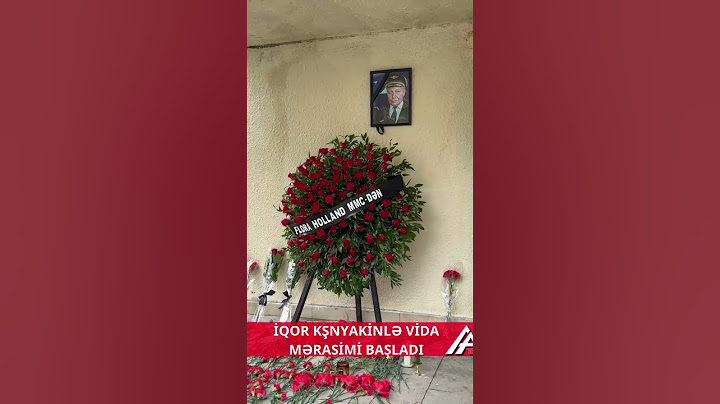 Təyyarədə ölən pilotun yaşadığı binanın girişinə əklil qoyuldu