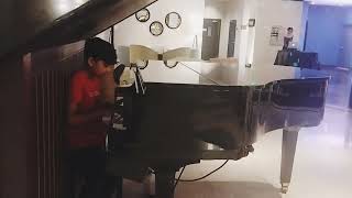 Little Master playing piano at Grand Mercure Bangkok Atrium Hotel