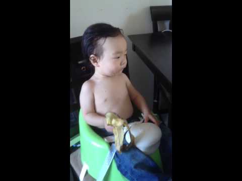 hot boy eating a banana all by himself