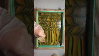 Linear soap swirl. Pouring down the sides of the mold.  Cold process soap making.