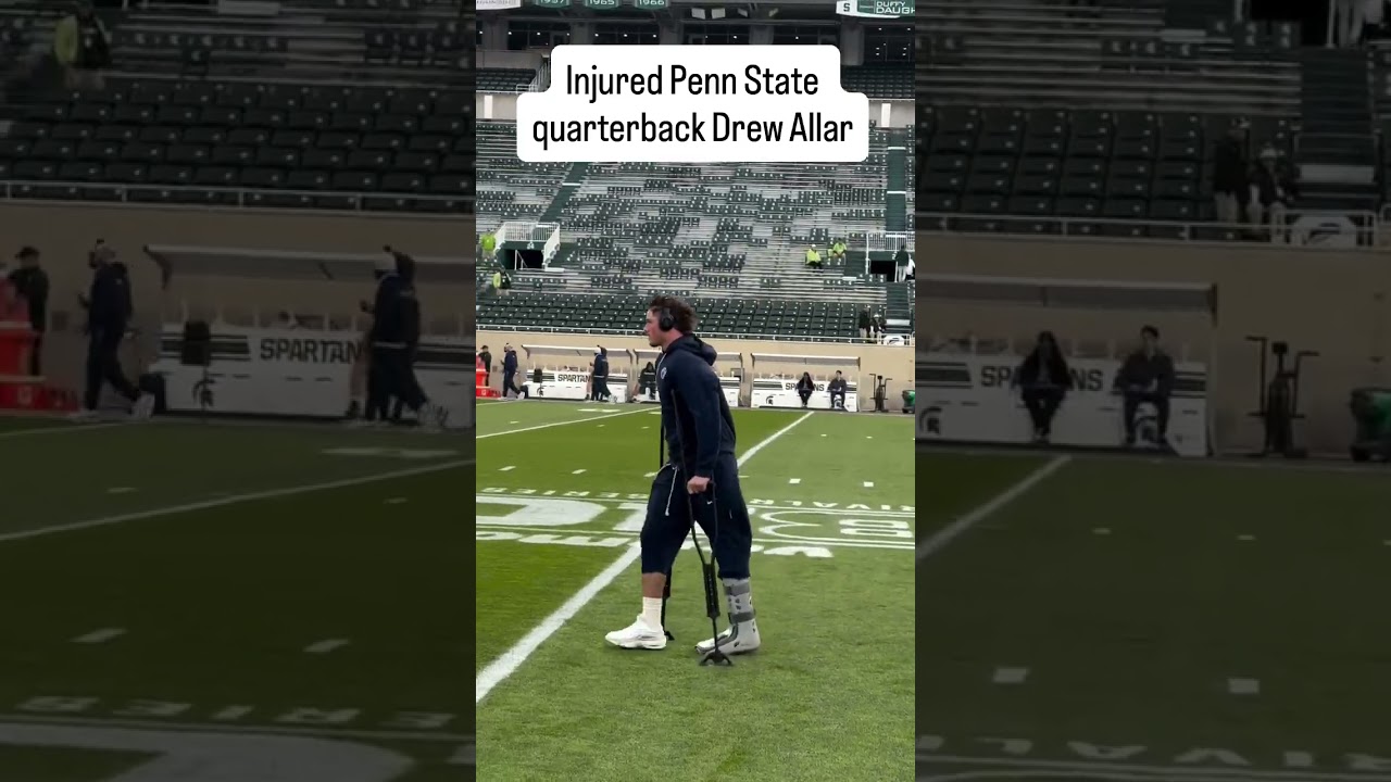 Injured Penn State quarterback Drew Allar makes his way onto the field before Michigan State game