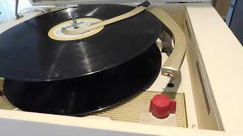 Webcor Musical automatic portable record player playing a couple LP