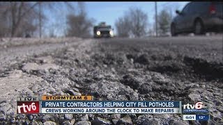 Private contractors helping city fill potholes