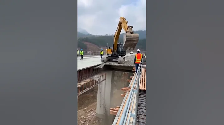 Dust and Debris Explode as Bridge Section Collapses