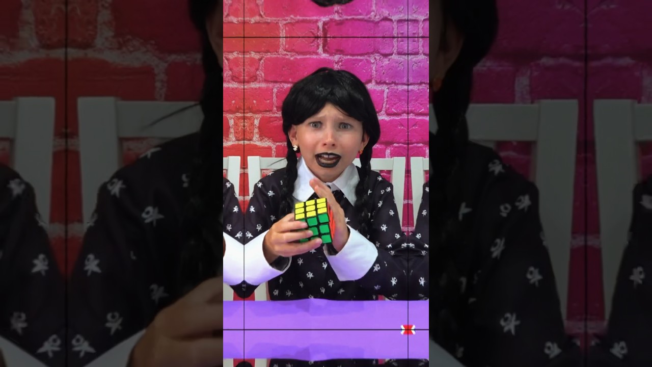 Wednesday Addams tries to solve Rubik’s Cube 
