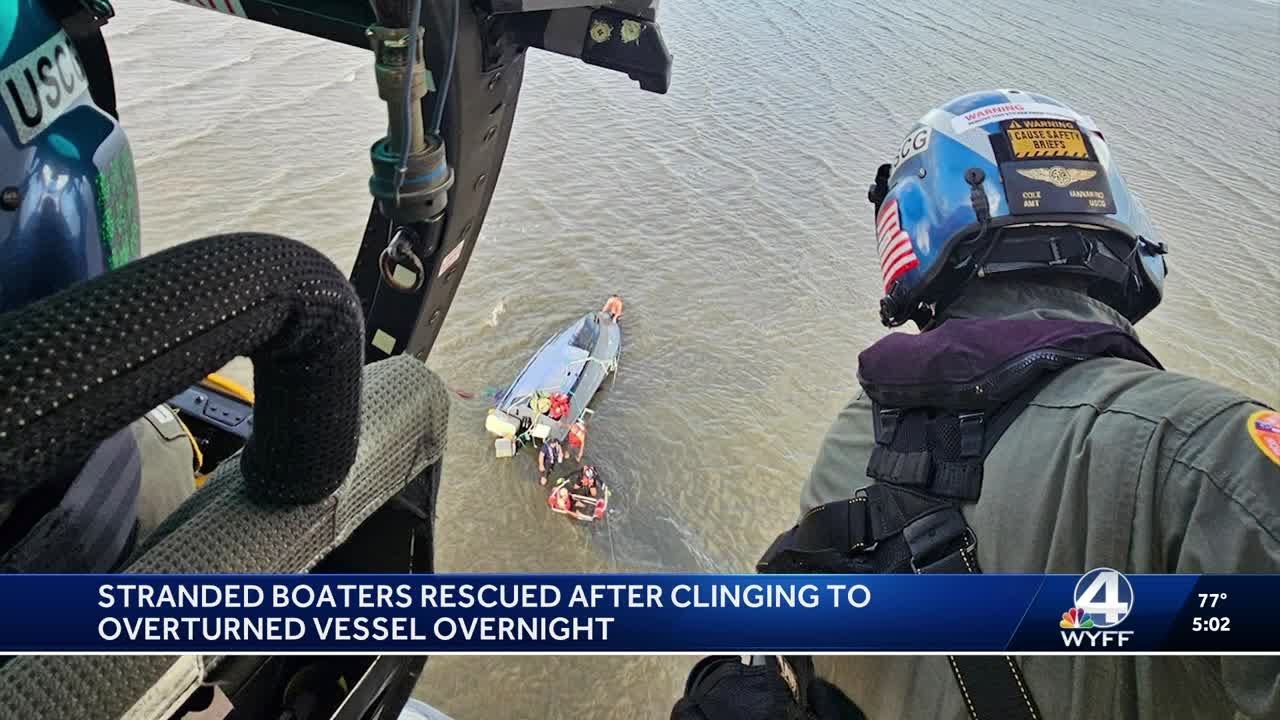 Stranded boaters rescued after clinging to overturned vessel overnight ...