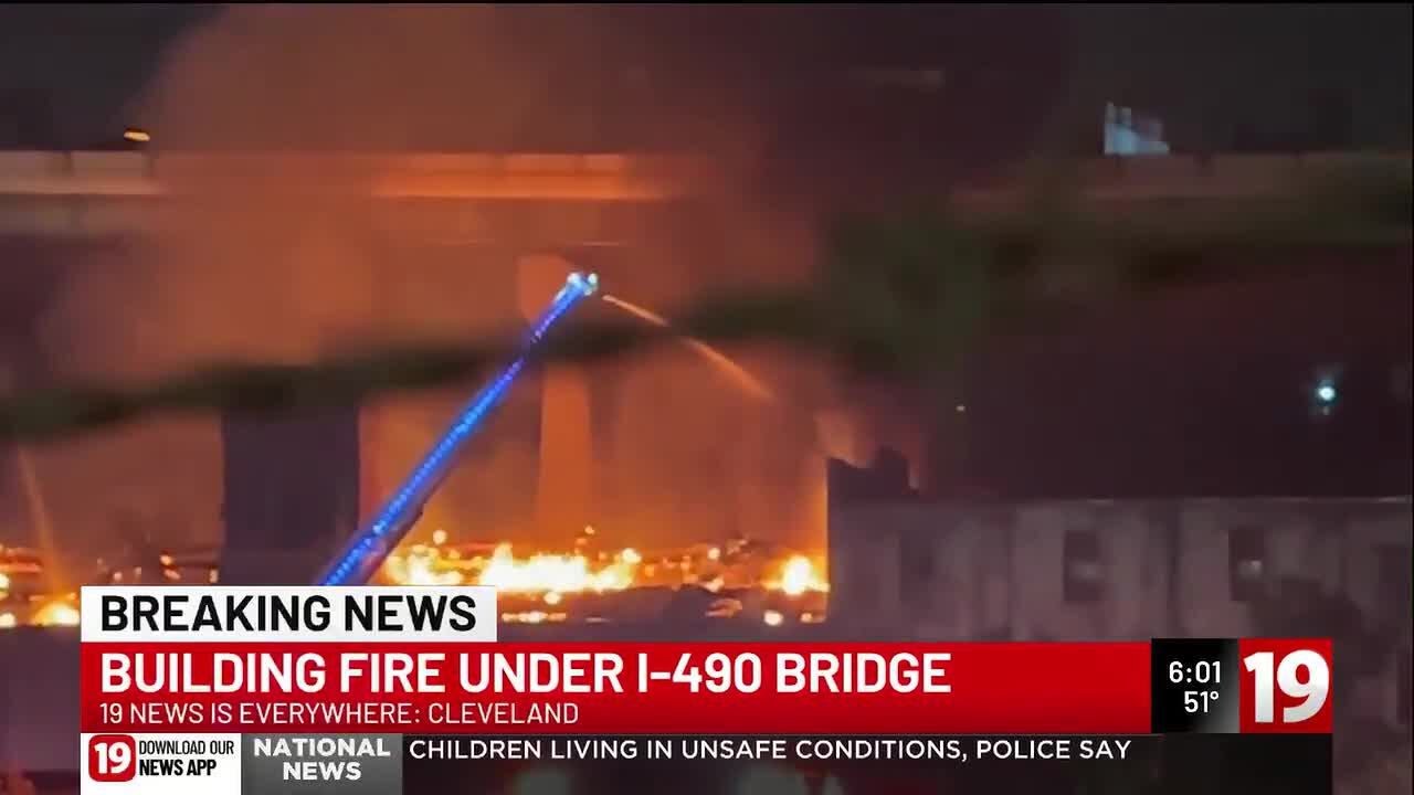Building fire under I-490 bridge - YouTube