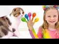 Nastya pretends to play and teaches kittens colors