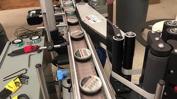 Wrap Labeling System for Long Skinny Labels for Bottom of Round Products