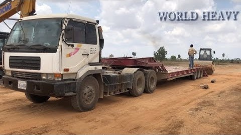 Road roller loading trailer and driving skills