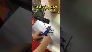Still fixing toys to backing cards by hand?