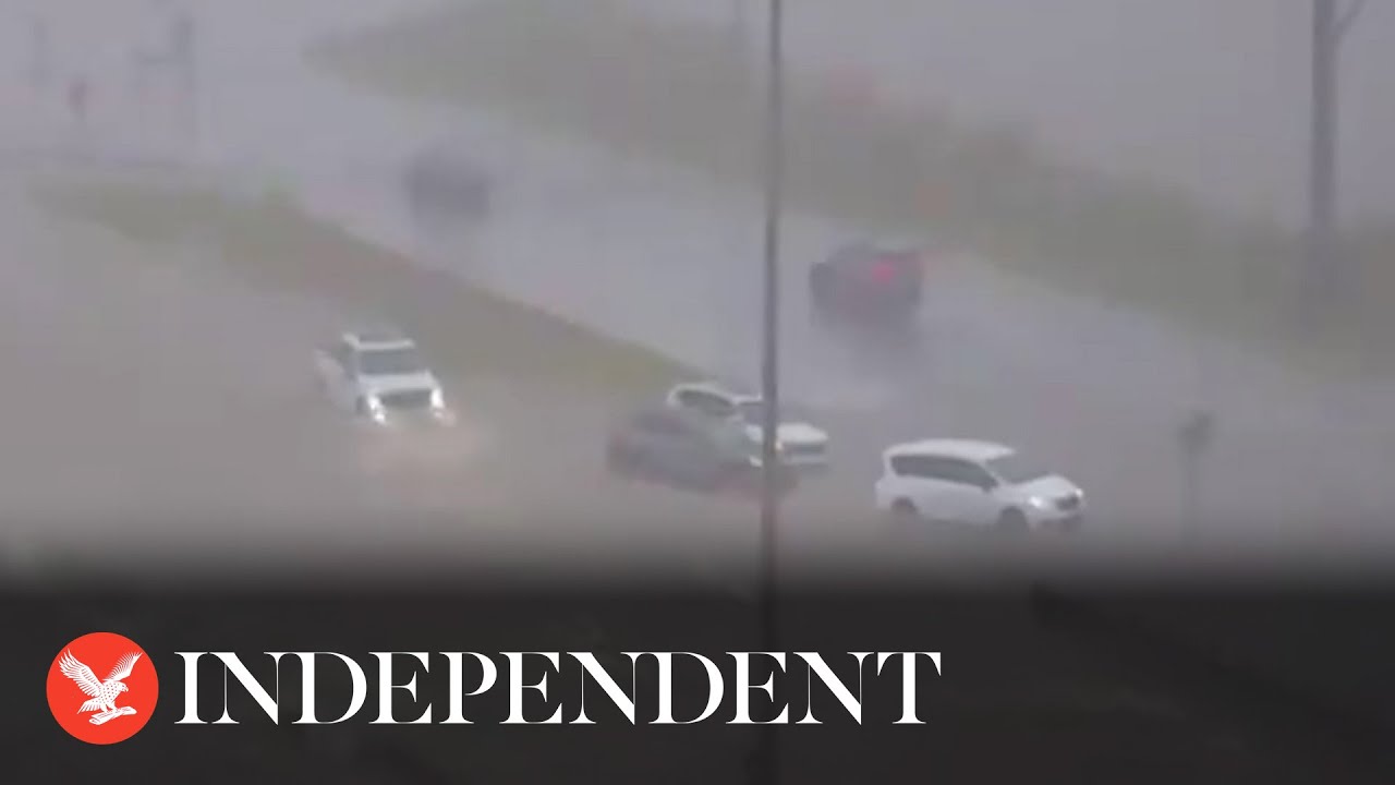 Cars submerged by flash flood water on Alabama highway