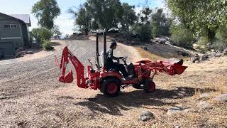 Moving rocks in my yard with Kubota BX23S