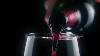 FREE VIDEO FOOTAGE NO COPYRIGHT Pouring red wine from a bottle, very close view