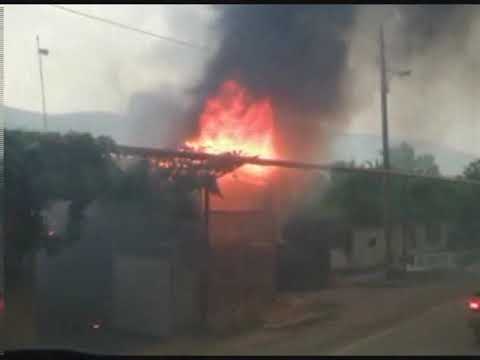 Russian troops goes through Tamarasheni village burned out by Ossetians