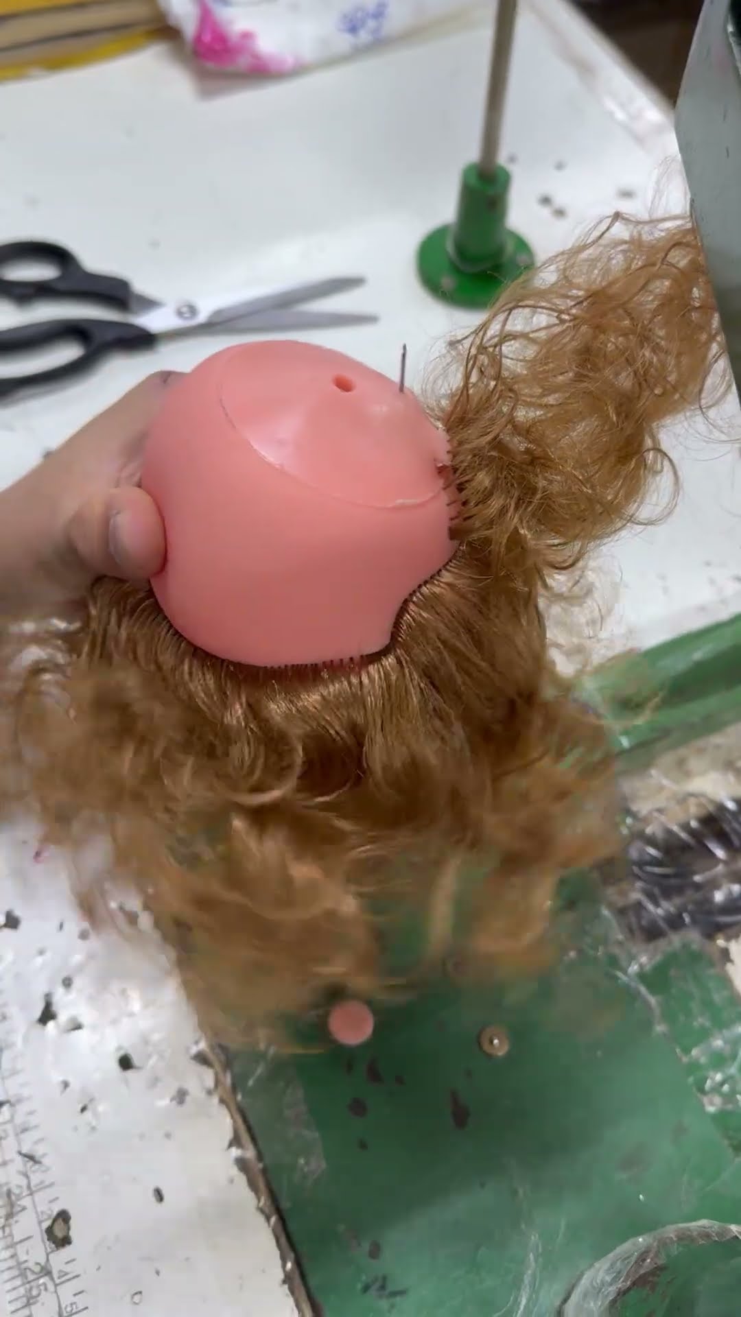 Sewing Hair Onto a Doll's Head || ViralHog