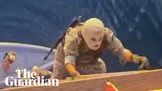 Footage purportedly shows Iranian forces seize two vessels in the strait of Hormuz