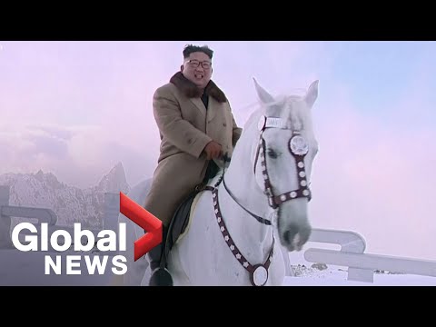 North Korea state TV airs new video of Kim Jong Un riding horse up sacred mountain with aids