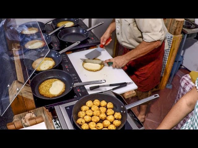 Italy Street Food. Soft Cheese Melted over Potatoes Pancake