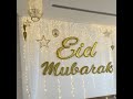 Eid Mubarak Gold Sign with String Lights and Decorations