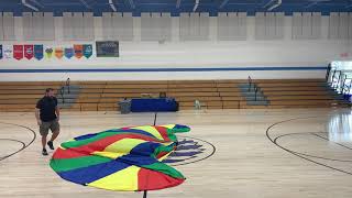Folding a parachute in physed.
