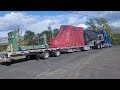 Traveling Man- Truck driver  using ramps and tarps on a stepdeck trailer