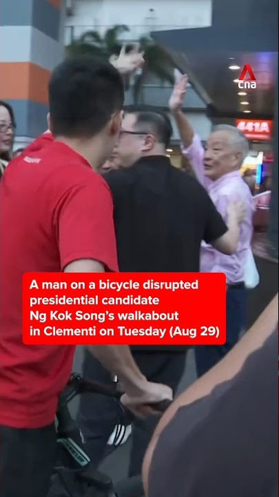 A man on a bicycle disrupted presidential candidate Ng Kok Song’s walkabout in Clementi on Aug 29