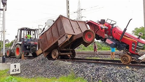 Mahindra Yuvo Tractor Accident On Railway Track While Working | New BobcatB900 Rescued Mahindra
