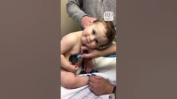 Adorable Baby Boy Cuddles on Nurse