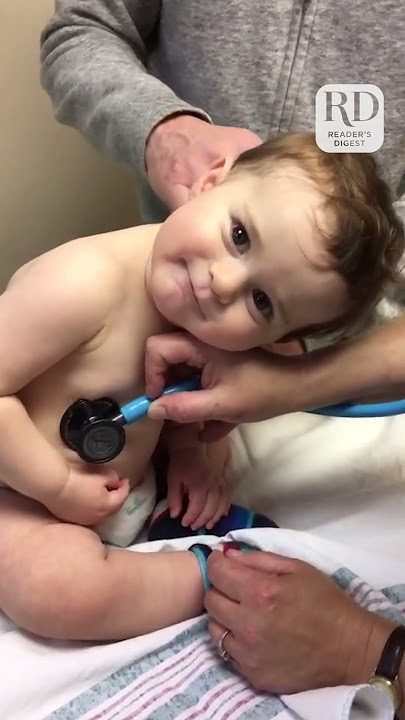 Adorable Baby Boy Cuddles on Nurse