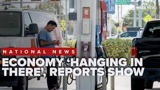 Economy 'hanging in there' as reports show slow growth, rising inflation