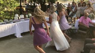 Bride mom and two daughters dance for groom