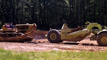 EUCLID SCRAPER PUSHED BY CAT D8