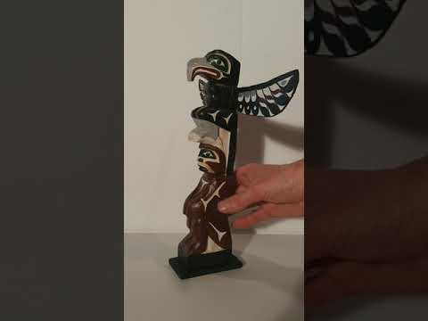 First nations thunder bird and first man totem pole