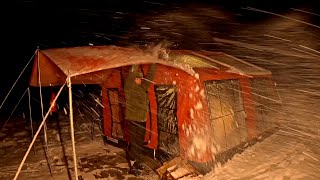 HOT TENT CAMP WITH STOVE IN RAIN AND HEAVY SNOWFALL