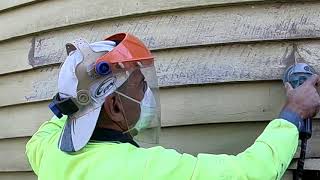 Sanding weatherboards and preparing for painting with 5' makita grinder