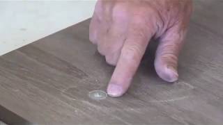 Drawer front adjusters