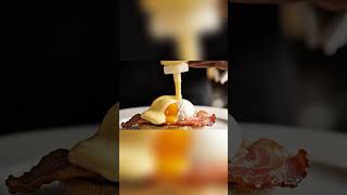 Pouring Hollandaise on Eggs Benedict
