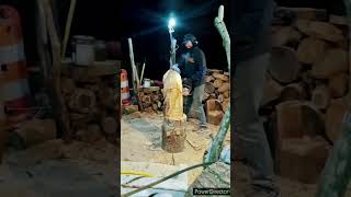 chainsaw carving a gnome
