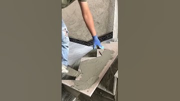 the process of installing ceramic tiles on the side of the stairs with a triangular shape #popular