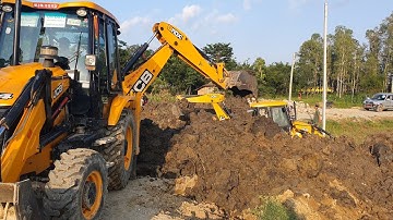 Two JCB Backhoe Working On Difficult Place - JCB Making Drain on Road to Install Culvert Pipe - 3